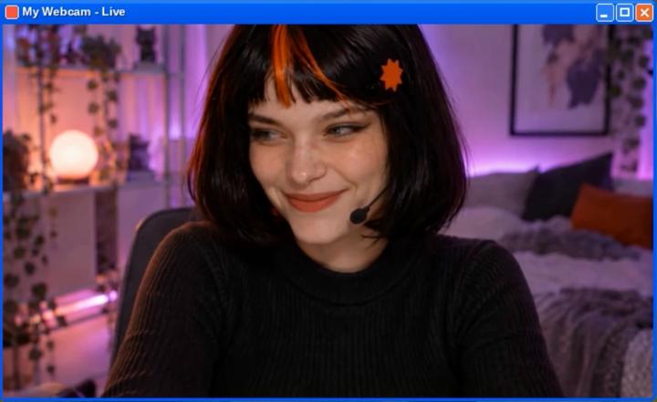 Claudia live on camera in a Windows-XP-style window titled My Webcam - Live.